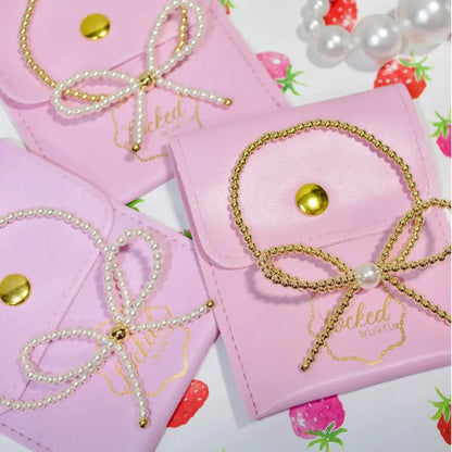 Glass Pearl Bow & Gold Bracelet